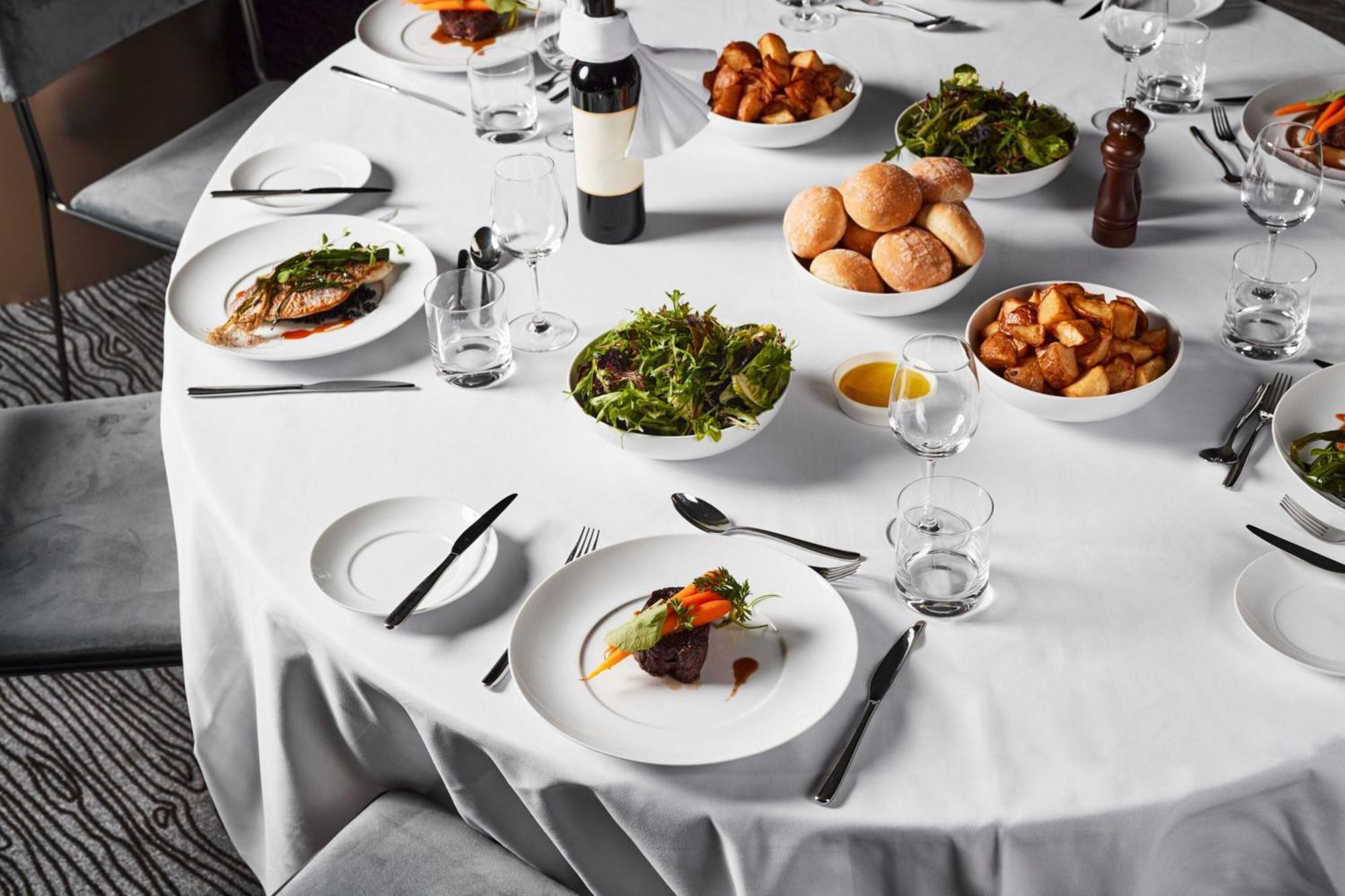 Melbourne Marriott Hotel Docklands Exterior photo A table set for a formal dinner